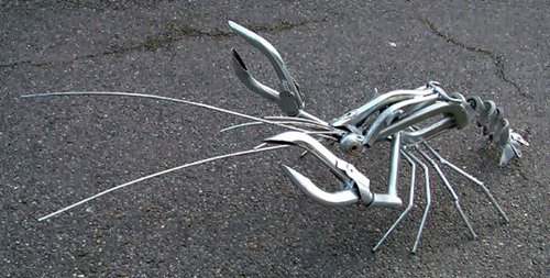 Скульптуры из колпаков на колёса (25 фото) Скульптуры из колпаков на колёса (25 фото)